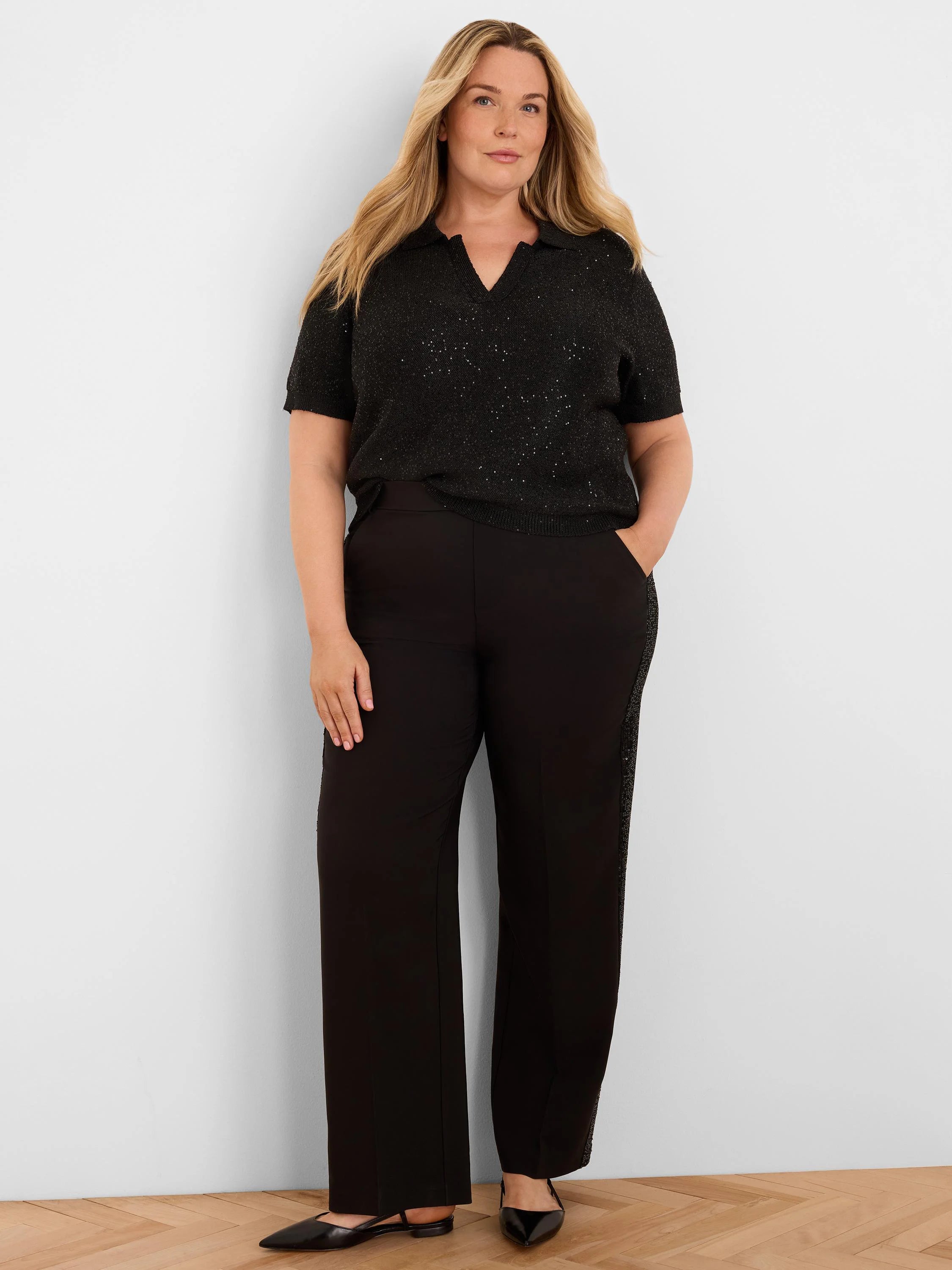 Black short-sleeve polo sweater with a V-neck, covered in subtle scattered sequins.