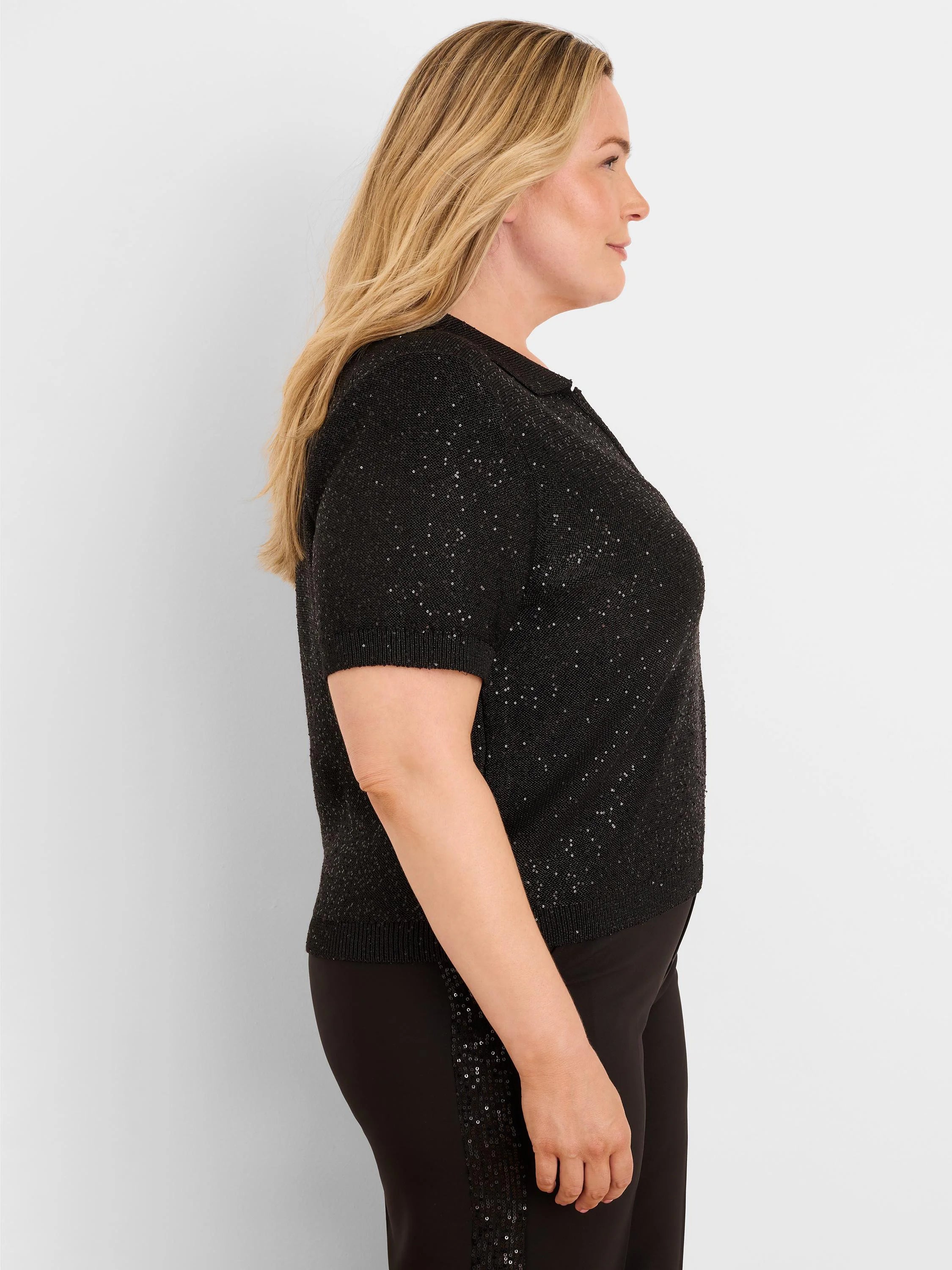 Black short-sleeve polo sweater, covered in small, reflective black sequins.