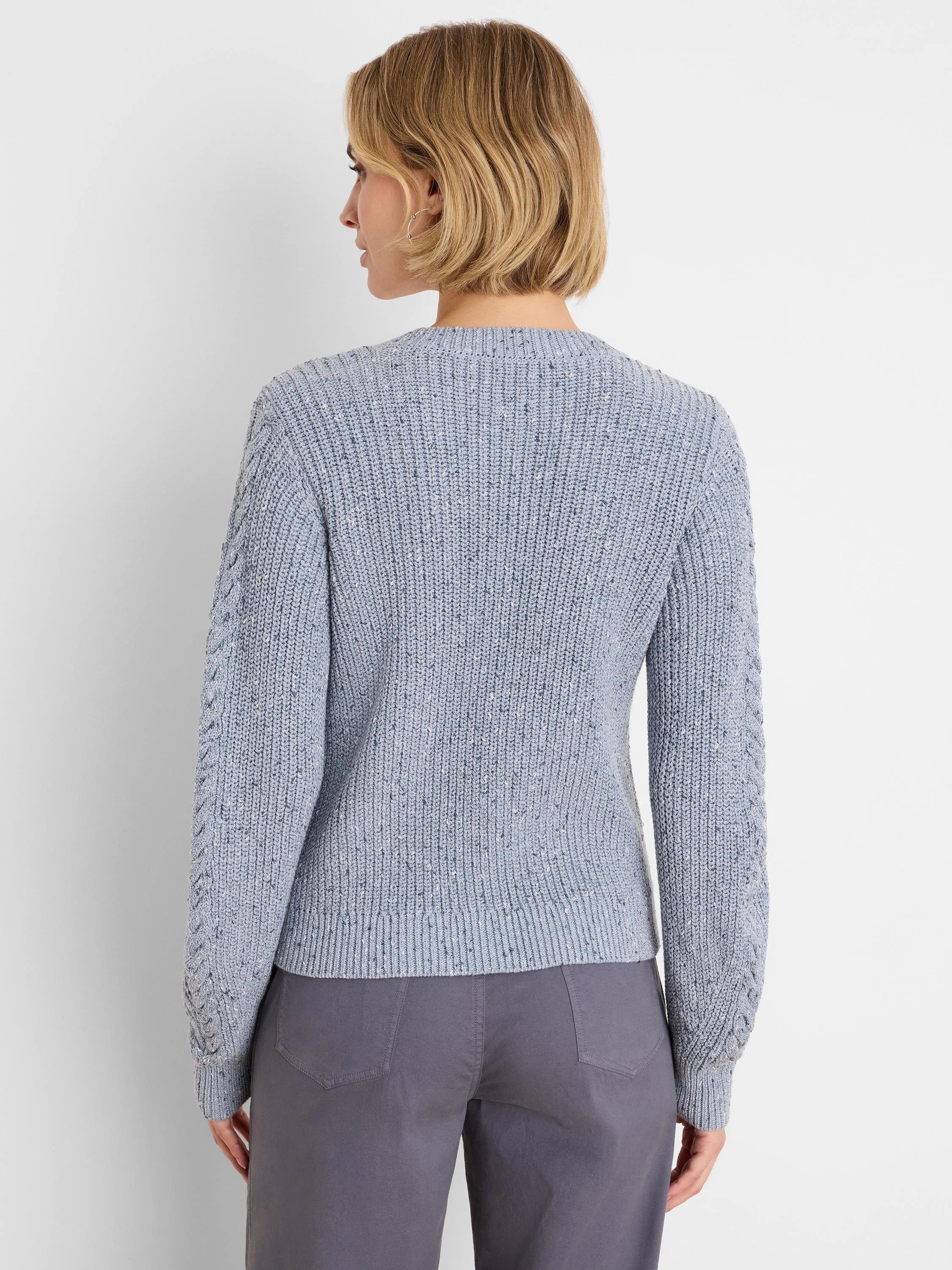 Light blue flecked shaker knit sweater with cable textured sleeves.