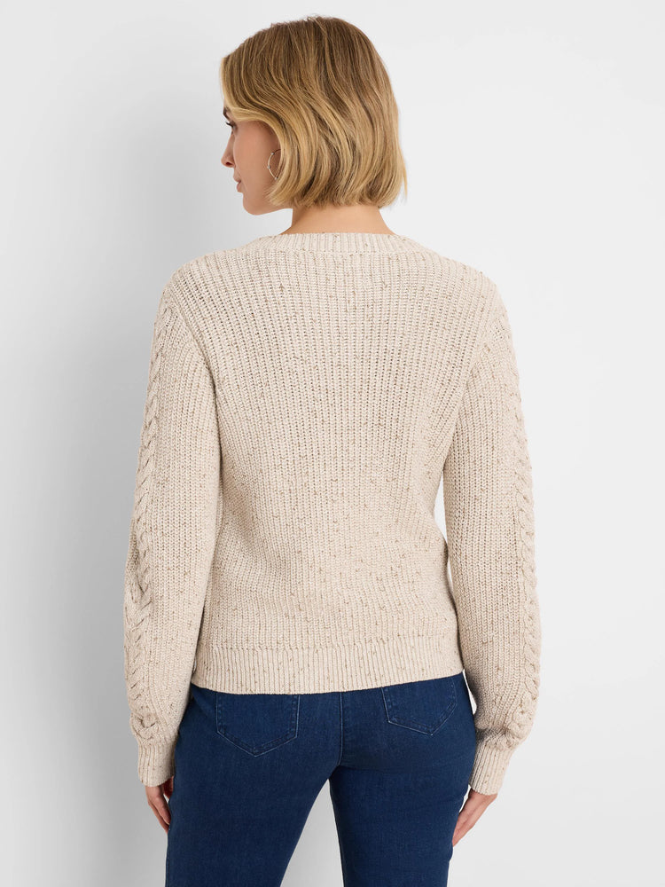 Cream flecked shaker knit cardigan with cable pattern on sleeves, shown from the back.