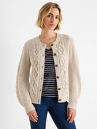 Oatmeal flecked cable knit cardigan with a round neck and brown buttons.