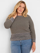 Marled grey crew neck sweater with a textured grid pattern in black, light grey, and yellow; solid grey lower hem.