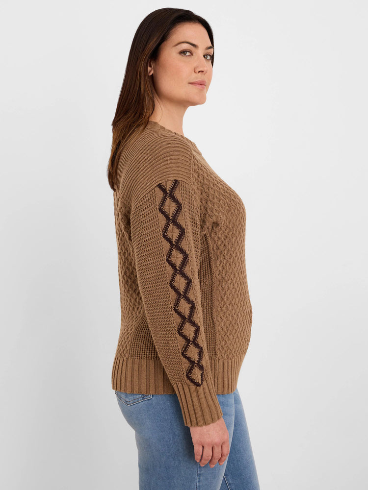 Brown sweater with dark brown criss-cross pattern knitted on sleeves. Ribbed cuffs and hem. Textured knit body.