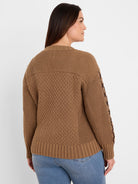 Camel brown sweater featuring a diamond-shaped cable knit on the body and sleeves, with ribbed cuffs, hem, and yoke.