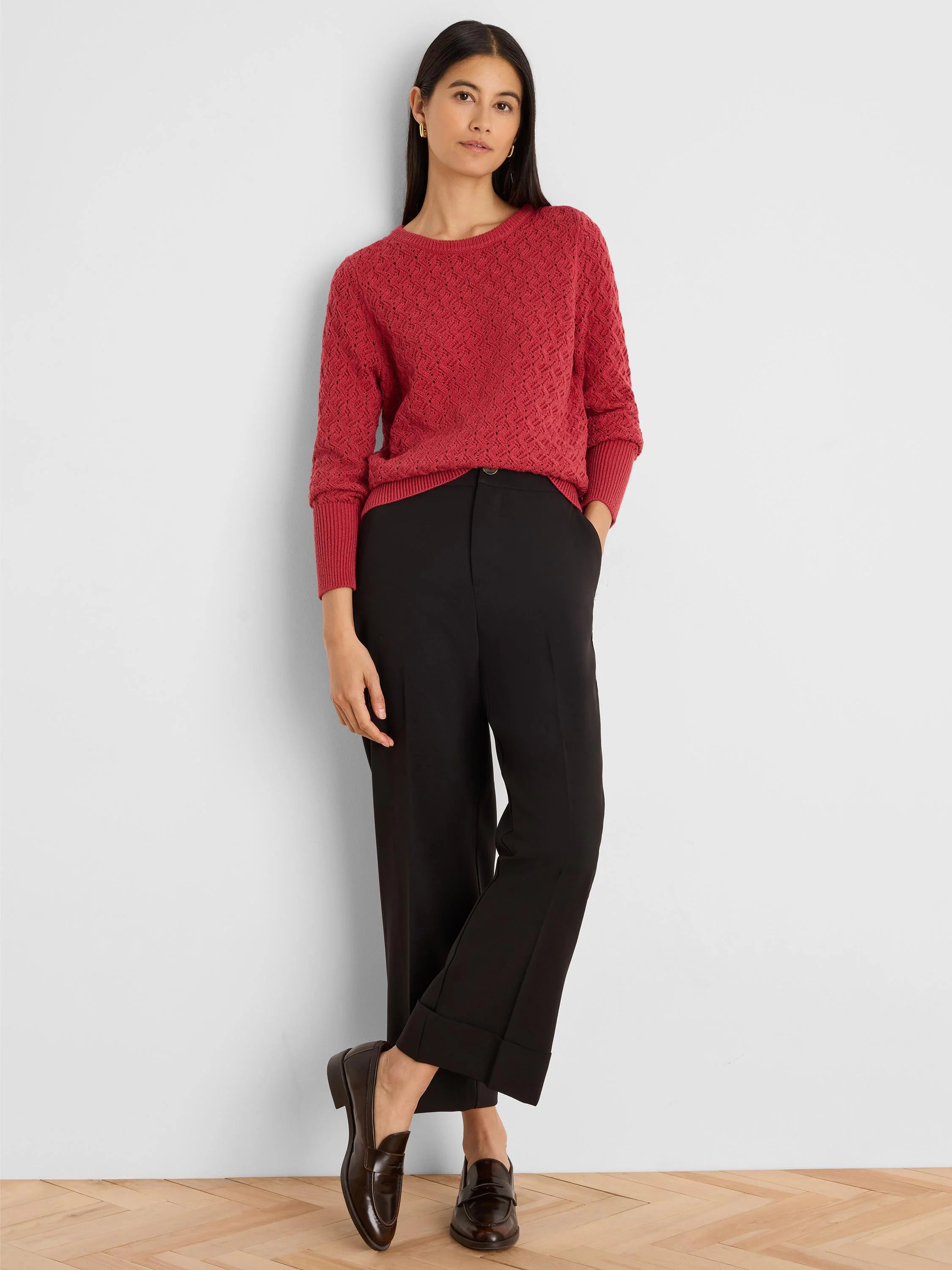 Deep red long-sleeve sweater with an all-over textured stitch pattern.