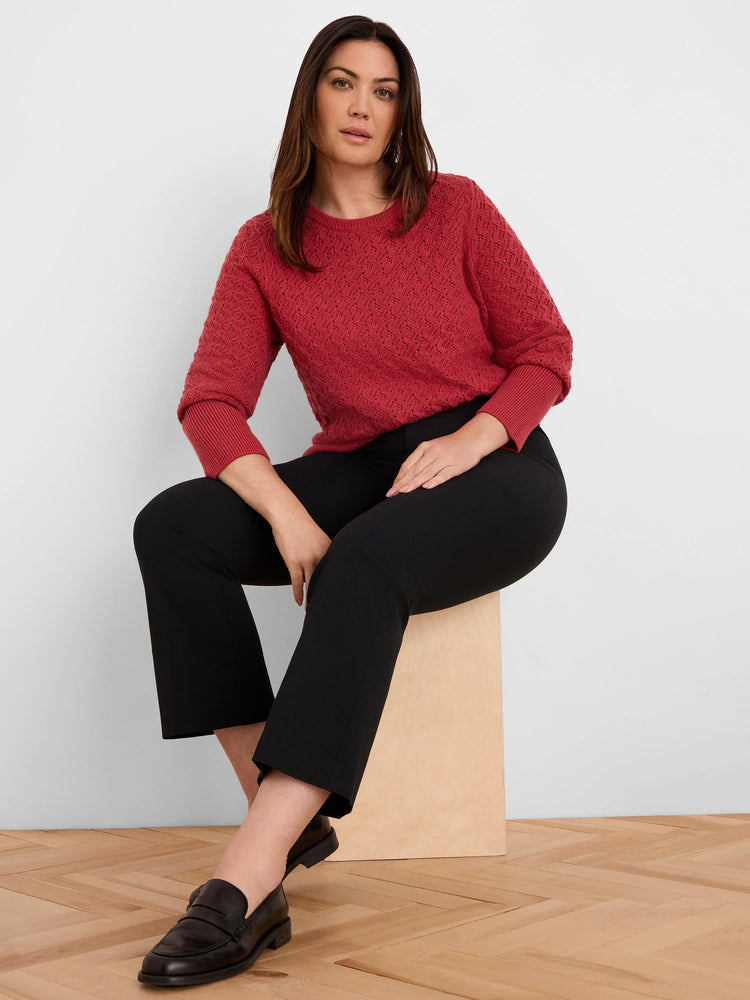 Red crew neck sweater with a distinctive sterling stitch pattern and ribbed cuffs.