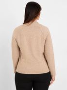 Back view of a beige knit sweater with a folded collar, raglan sleeves, and ribbed hem.