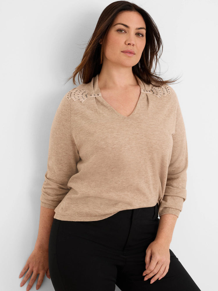 Beige V-neck sweater with beaded, cinched shoulder details.