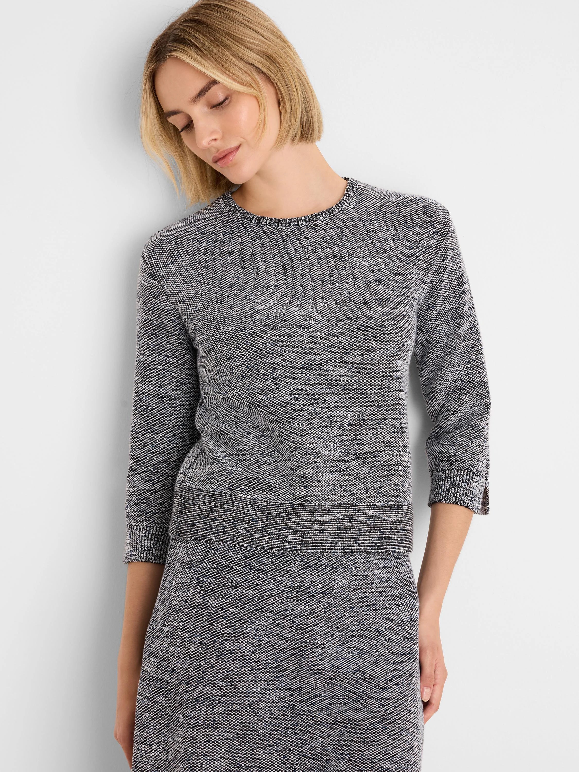 Black & white speckled tweed stitch sweater, round neck, 3/4 sleeves.