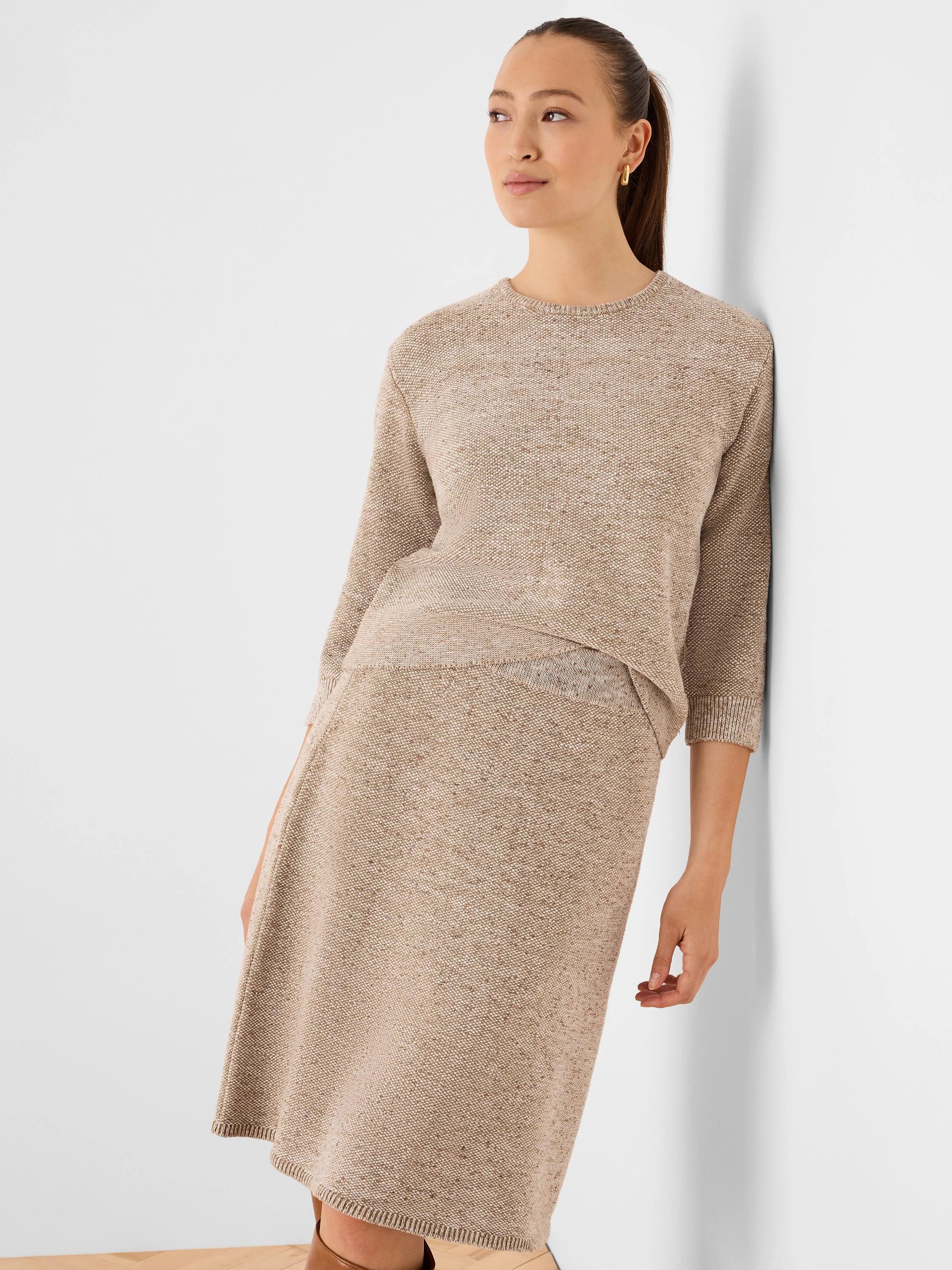Oatmeal tweed stitch sweater with a crew neck and 3/4 sleeves.