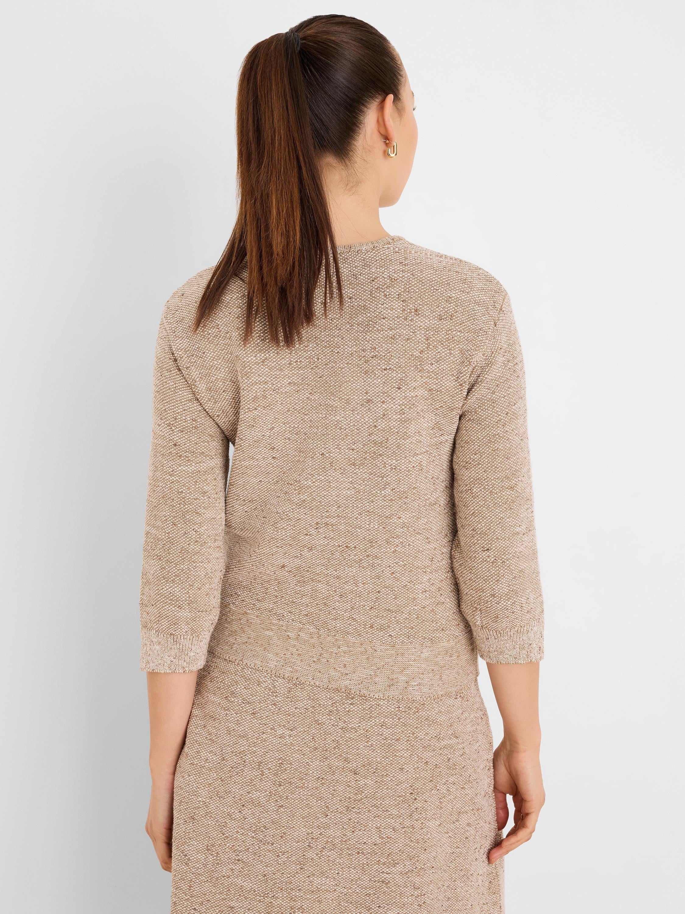 Multi-tonal beige tweed sweater, back view, with 3/4 sleeves and ribbed cuffs and hem.