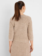 Multi-tonal beige tweed sweater, back view, with 3/4 sleeves and ribbed cuffs and hem.