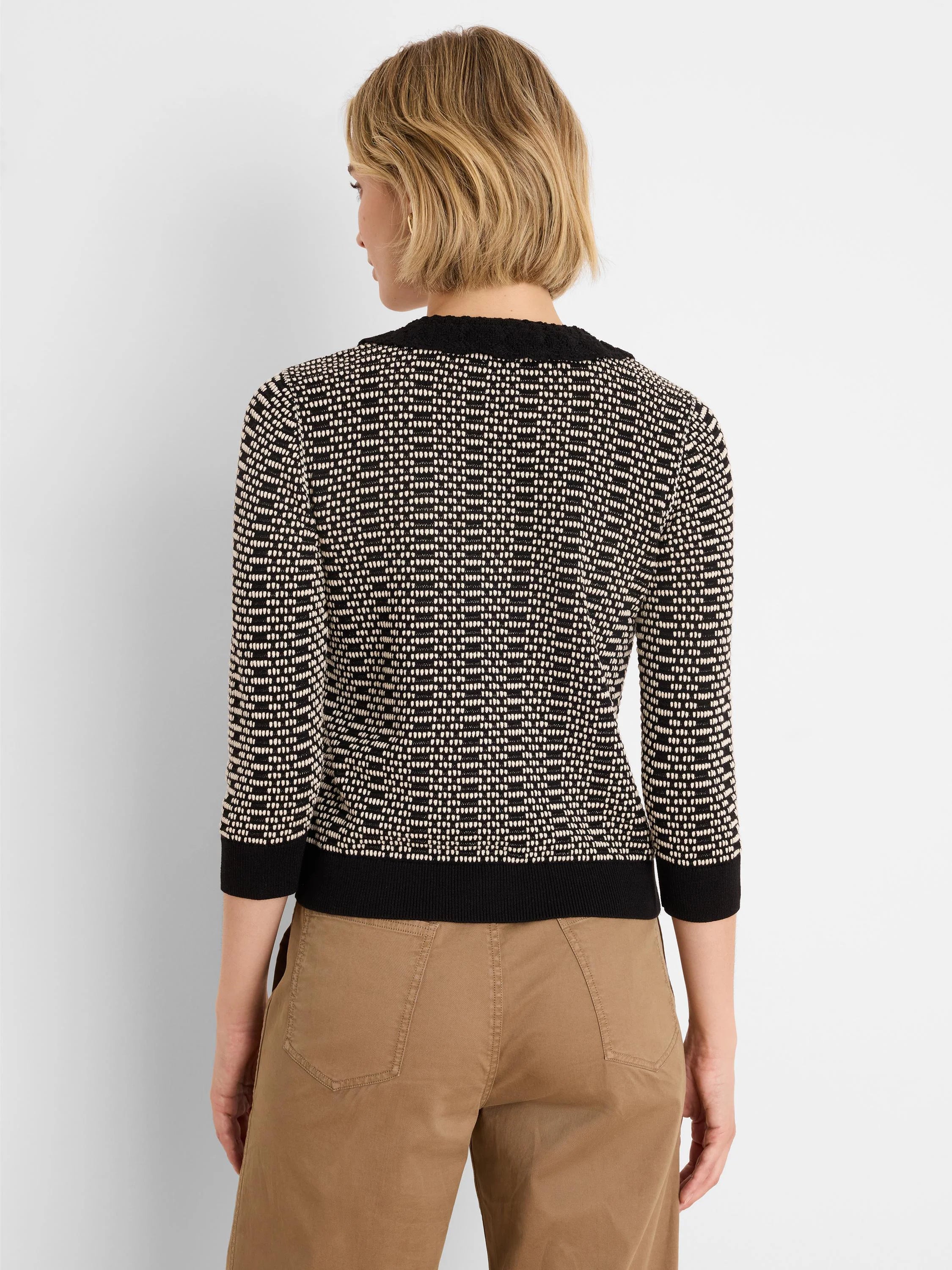 Black & cream geo stitch sweater with lace trim collar, 3/4 sleeves, shown from back.