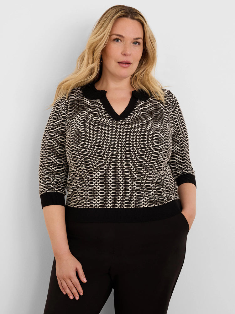Black & beige geo stitch sweater with 3/4 sleeves, ribbed black cuffs & hem, and a black lace-trim V-neck.