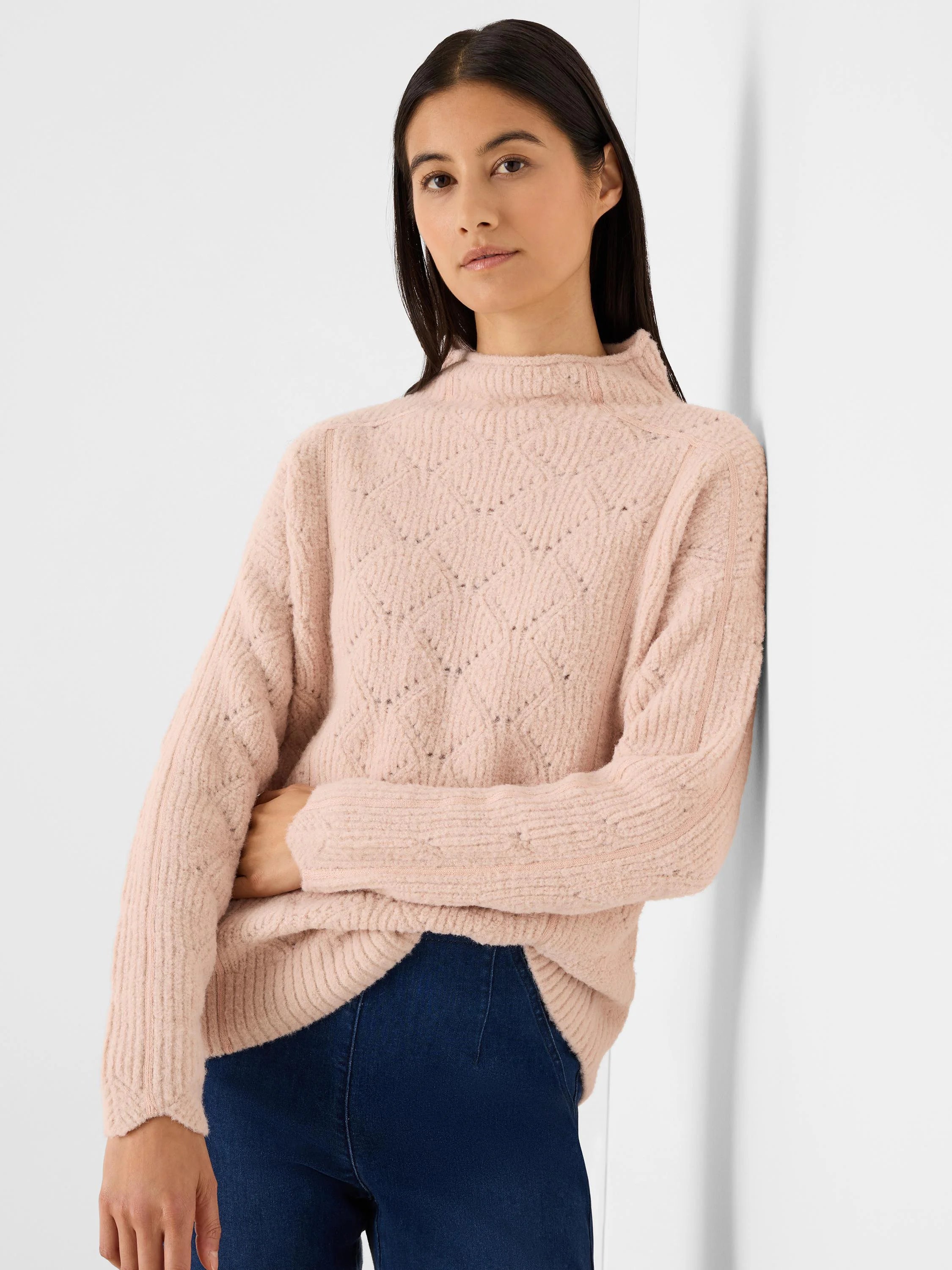Light pink fuzzy mock neck sweater with diamond knit pattern and ribbed cuffs.