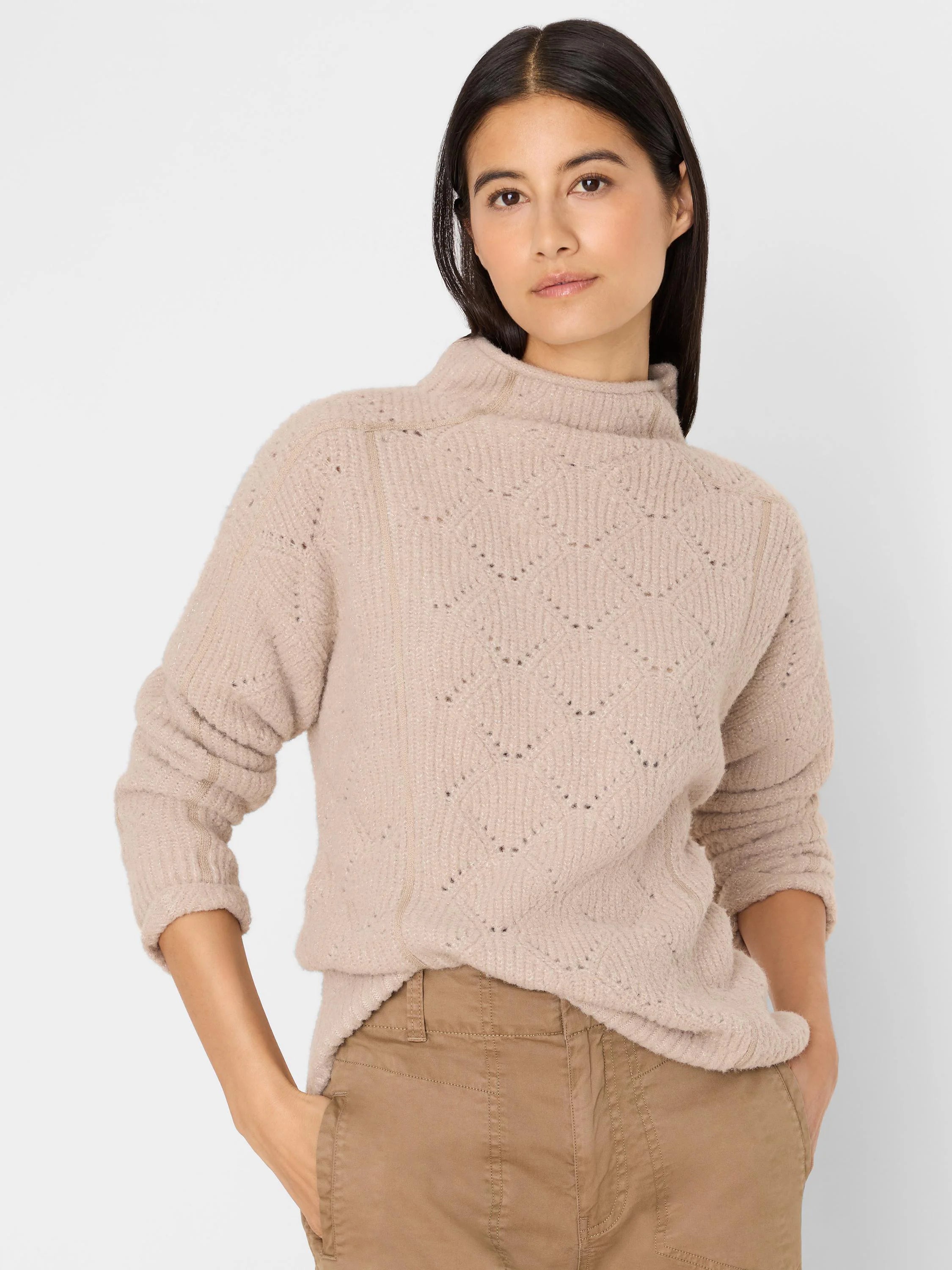 Pale beige fuzzy mock neck sweater with open-work diamond knit pattern.