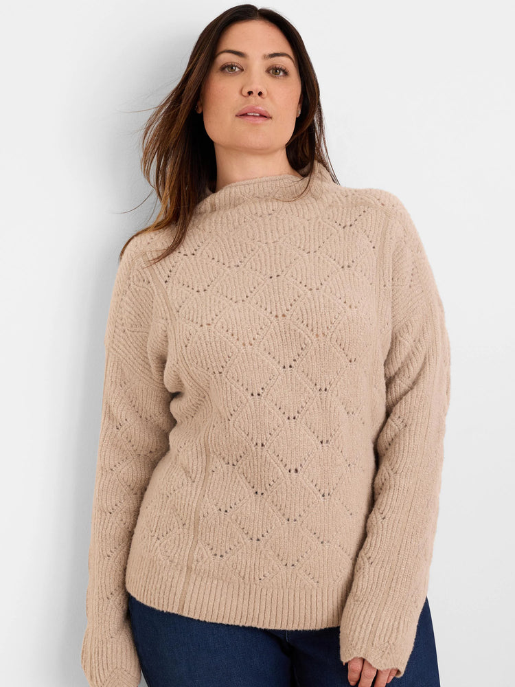 Beige mock neck sweater with diamond-patterned open knit and subtle sparkle. Ribbed hem and cuffs.