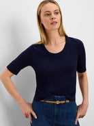 Navy pure cotton sweater tee with a scoop neck, short ribbed sleeves, and subtle decorative shoulder tabs.