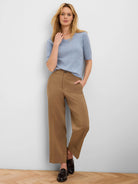 Pale blue, short-sleeved knit top with a rounded neckline.