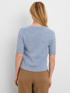 Light blue pure cotton sweater tee, back view. Short sleeves, ribbed round neck, cuffs, and bottom hem.