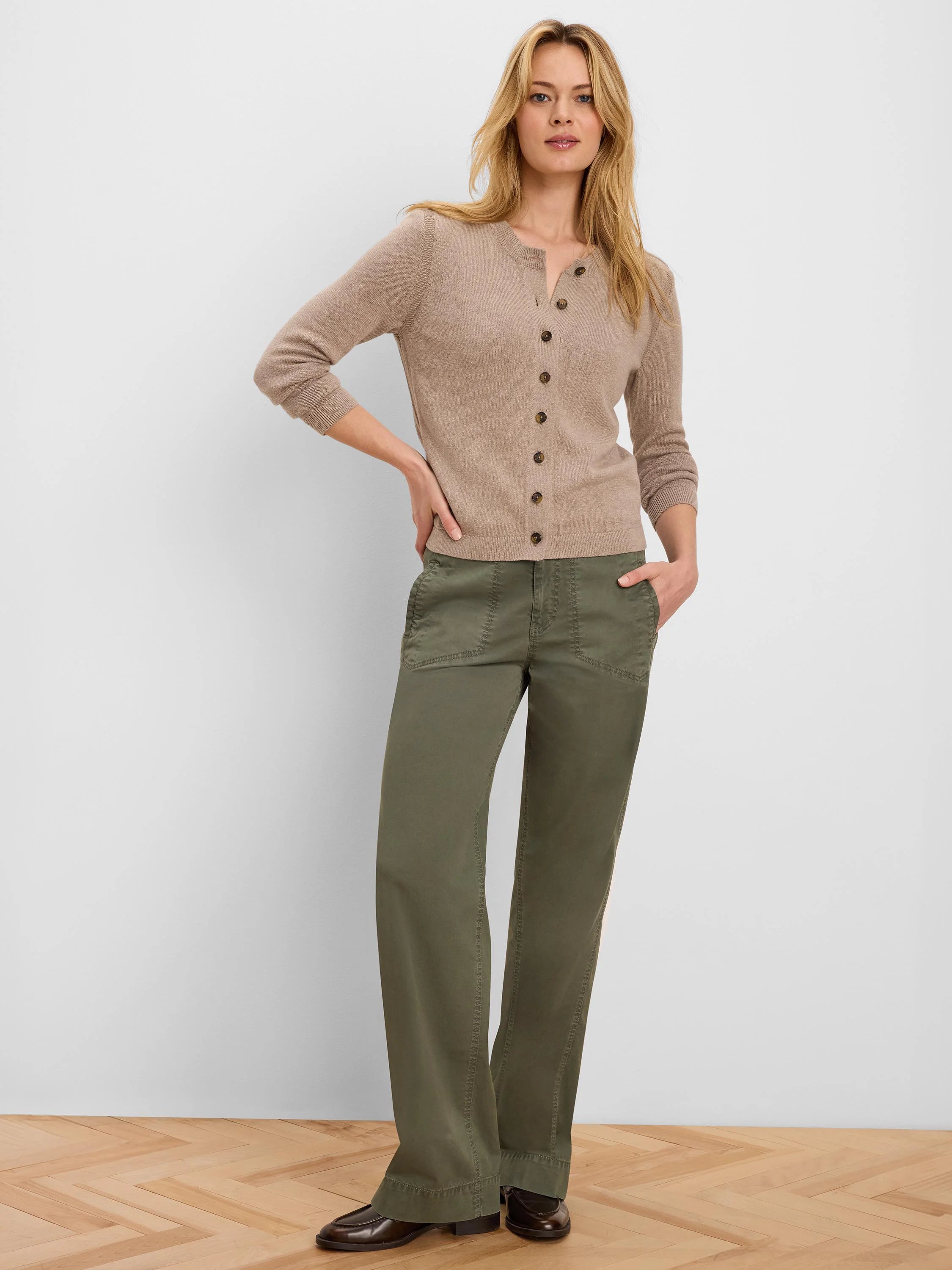 Beige button-up cardigan with dark brown buttons, ribbed cuffs, and hem.