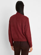 Dark burgundy knit cardigan, back view. Mock neck, center back seam, ribbed cuffs and hem.