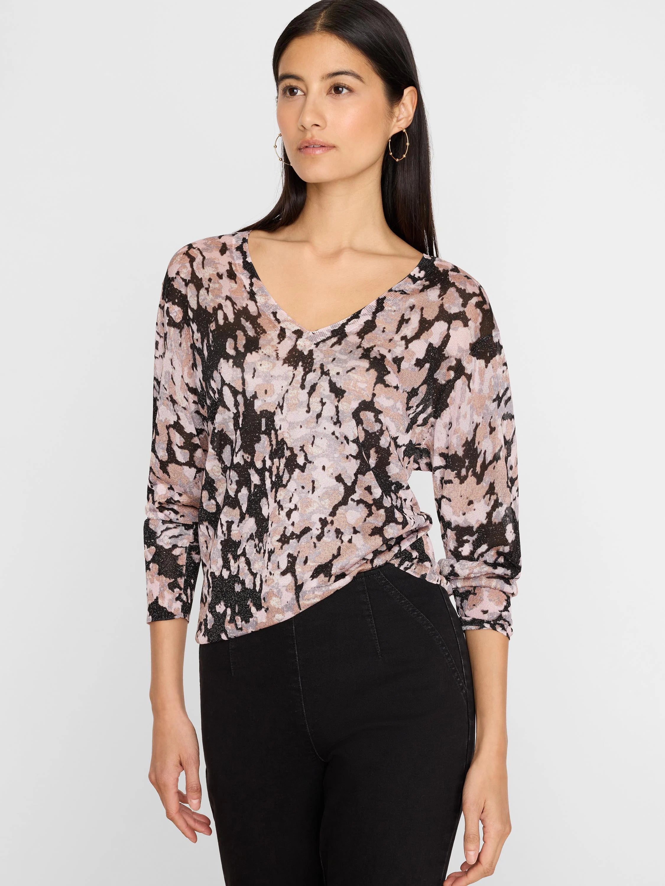 V-neck sweater with abstract pattern: black, mauve pink, and beige with a subtle shimmer. Features 3/4 sleeves.