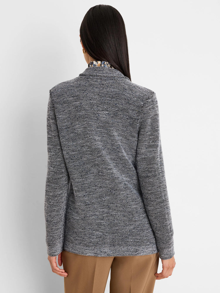 Black and white tweed stitch sweater jacket, back view. Fine weave with subtle blue flecks.