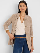 Light beige tweed stitch sweater jacket, collared with three front buttons.