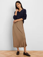 Navy blue V-neck ribbed knit sweater on a model.