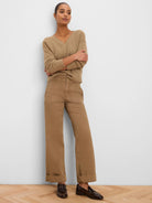 Tan, prominently ribbed V-neck pullover sweater.