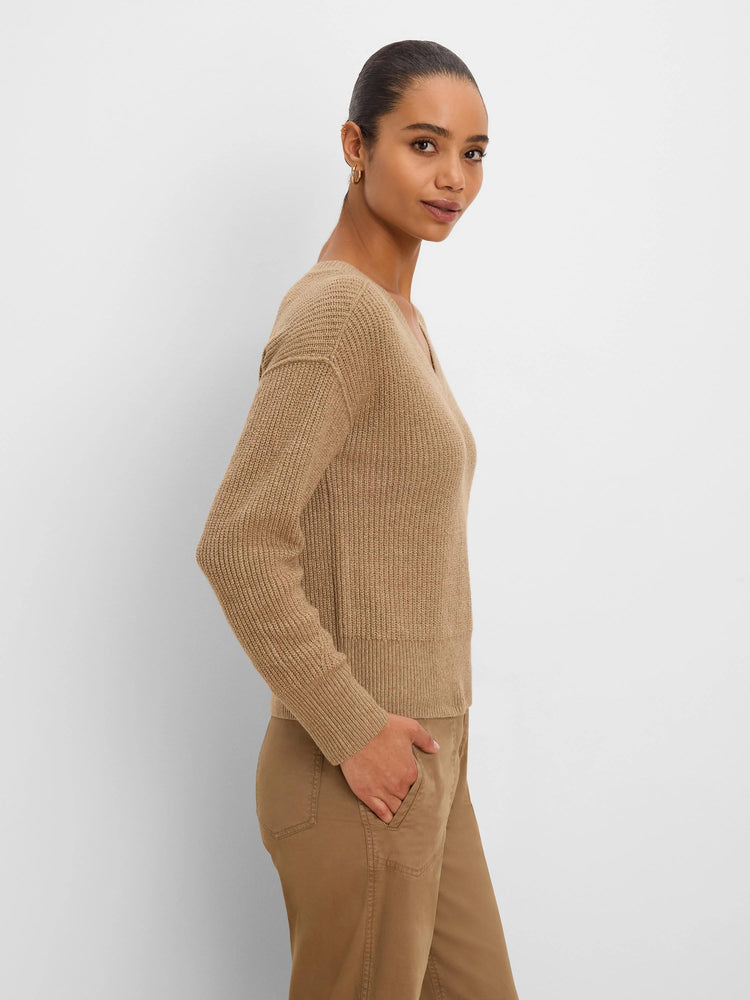 Tan V-neck sweater with a ribbed knit texture.