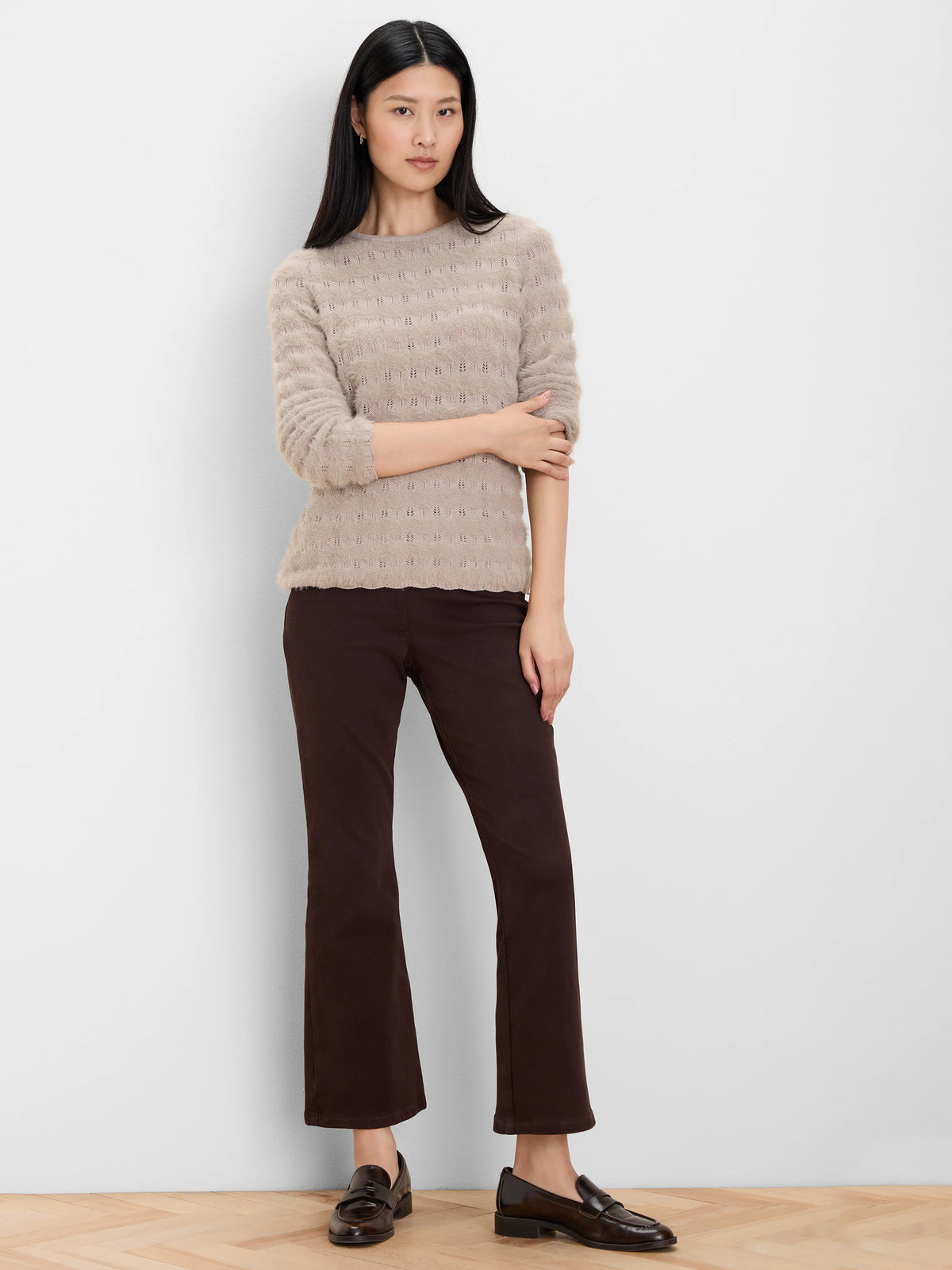 Light beige fuzzy knit sweater with wavy textured pattern and scalloped hem.