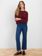 Burgundy fuzzy sweater with horizontal wave texture.