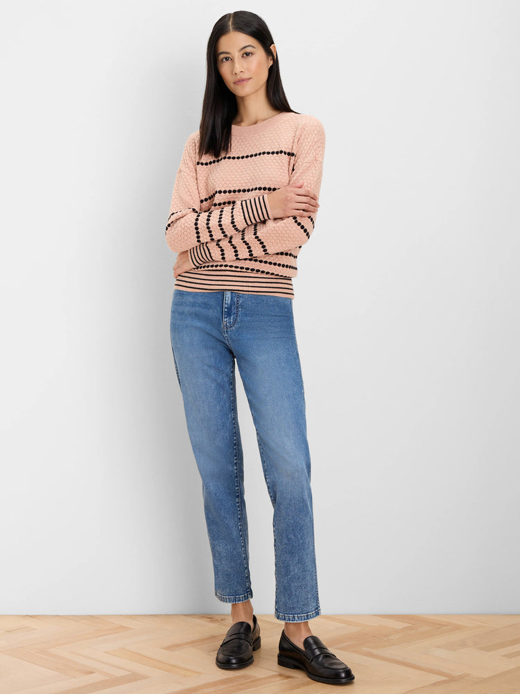 Pale pink knit sweater with black dotted horizontal stripes and solid black cuffs/hem.