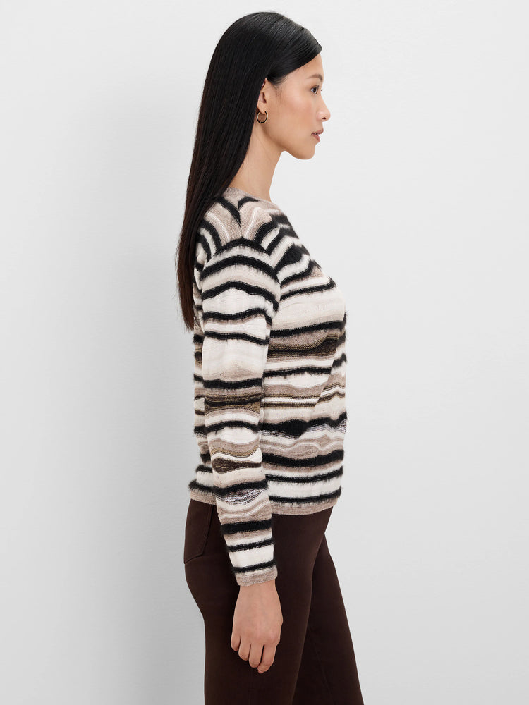 Black, cream, and brown horizontally striped sweater with varied fuzzy textures.