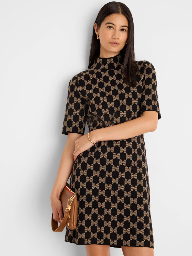 Black and tan knit dress with a geometric interlocking pattern. Mock neck, short sleeves.