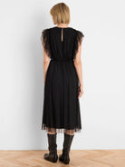 Black midi tulle dress with ruffled sleeves, elastic waist, keyhole back, and sheer tulle overlay skirt.