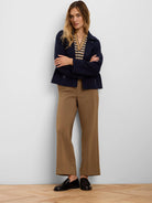 Camel brown wide-leg pants with deep cuffed ankles.