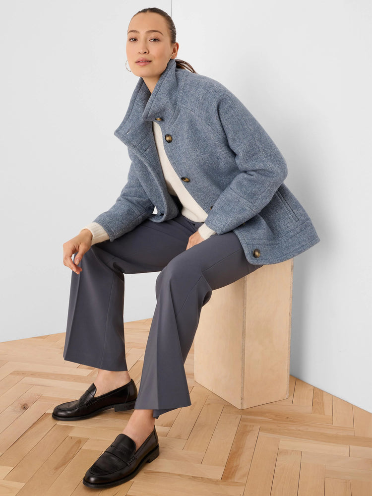 Dark grey wide-leg trousers with sleek fabric and a cropped length.