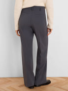 Dark gray wide-leg trousers, back view. Shows belt loops and two horizontal back pockets.
