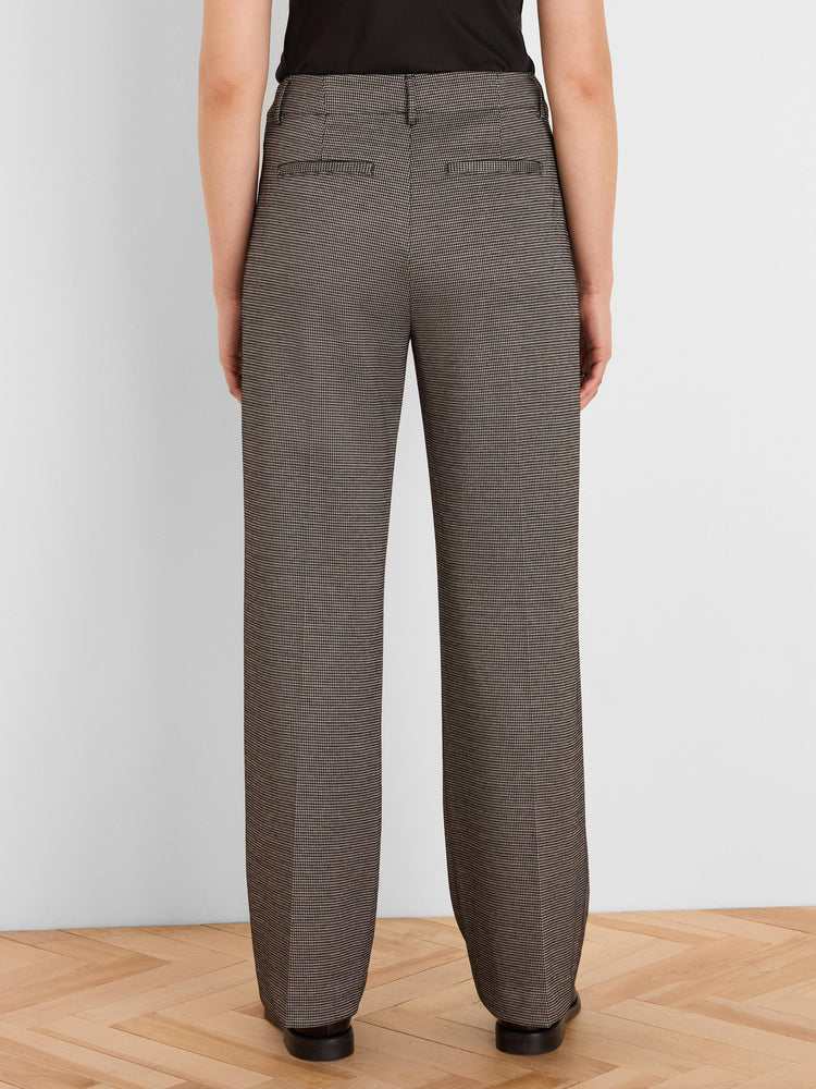 Brown and beige houndstooth tweed wide leg trousers, back view, with back welt pockets.