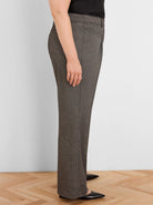 Wide-leg trousers in dark brown with a fine beige tweed pattern.