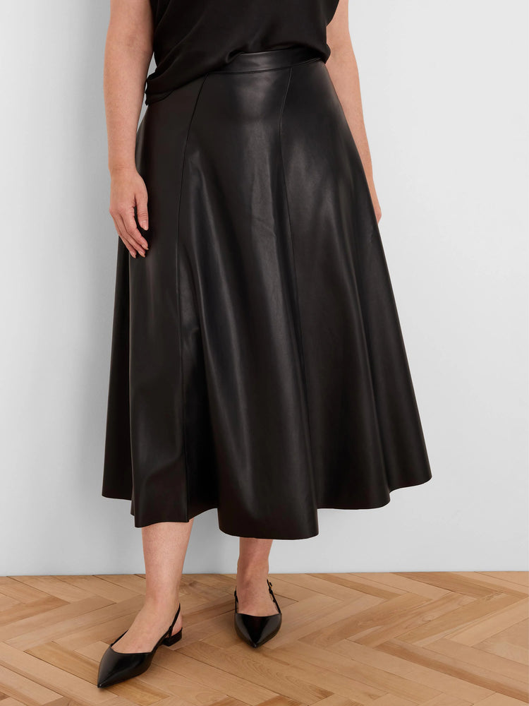 Black vegan leather A-line midi skirt with prominent vertical seams and a smooth finish.