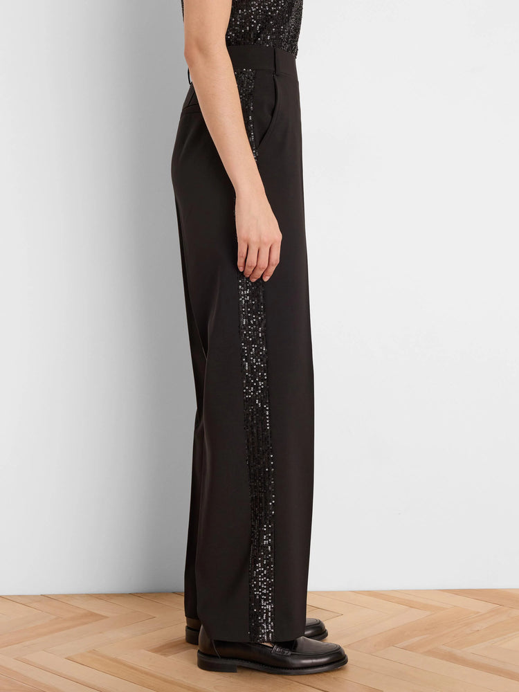 Black tuxedo pants with vertical black sequin stripes on the outer sides.