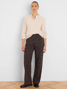Dark brown wide-leg pants, covered in a subtle pattern of small beige flecks.