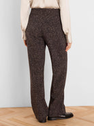 Dark brown wide-leg pants with a light speckled print, shown from the back with a high-waisted fit.