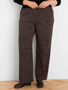 Dark brown wide-leg pants with a light speckled print, shown worn from the waist down.