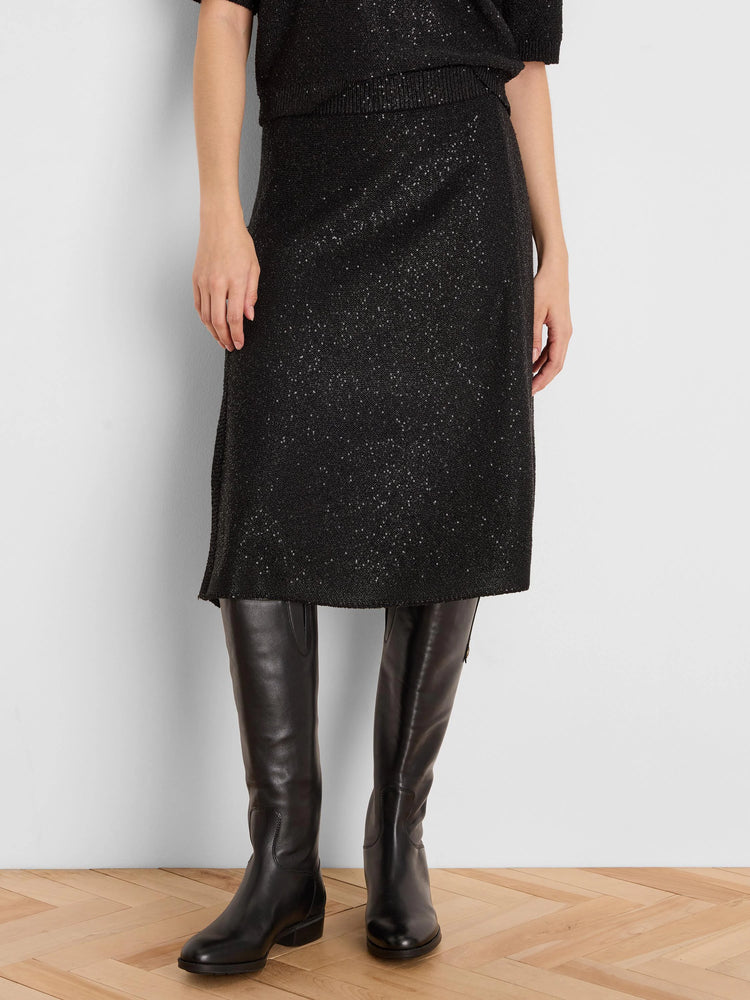 Black sequin knit skirt, straight cut, falls below the knee.