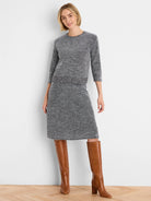 Black and white tweed stitch knit midi skirt with a ribbed hem.